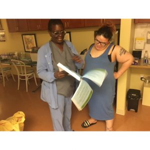 Nurse Jackie and mom going over some reading materials.