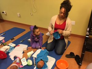 Mommy and big sister getting ready for baby